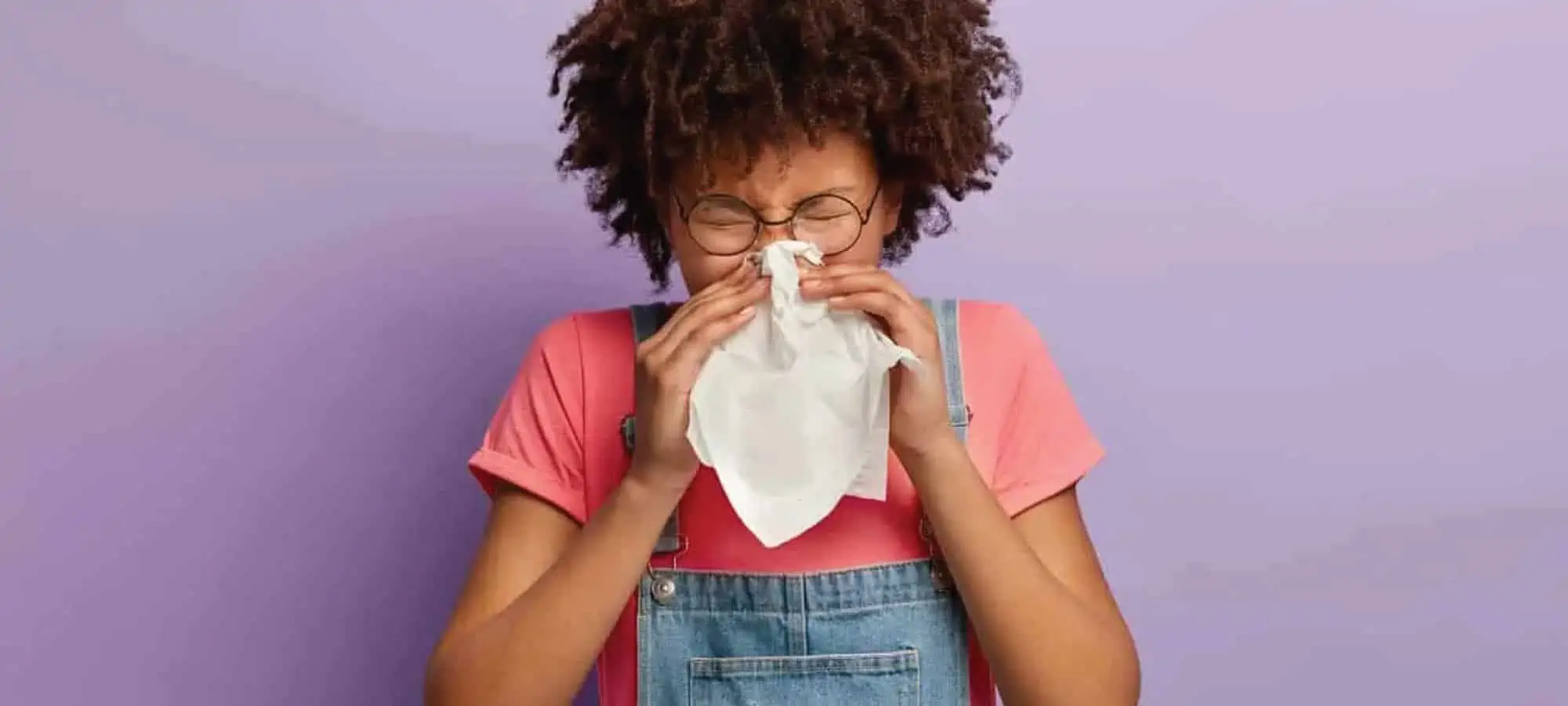 Women blowing her nose