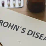 Notebook with Crohn's disease written on it