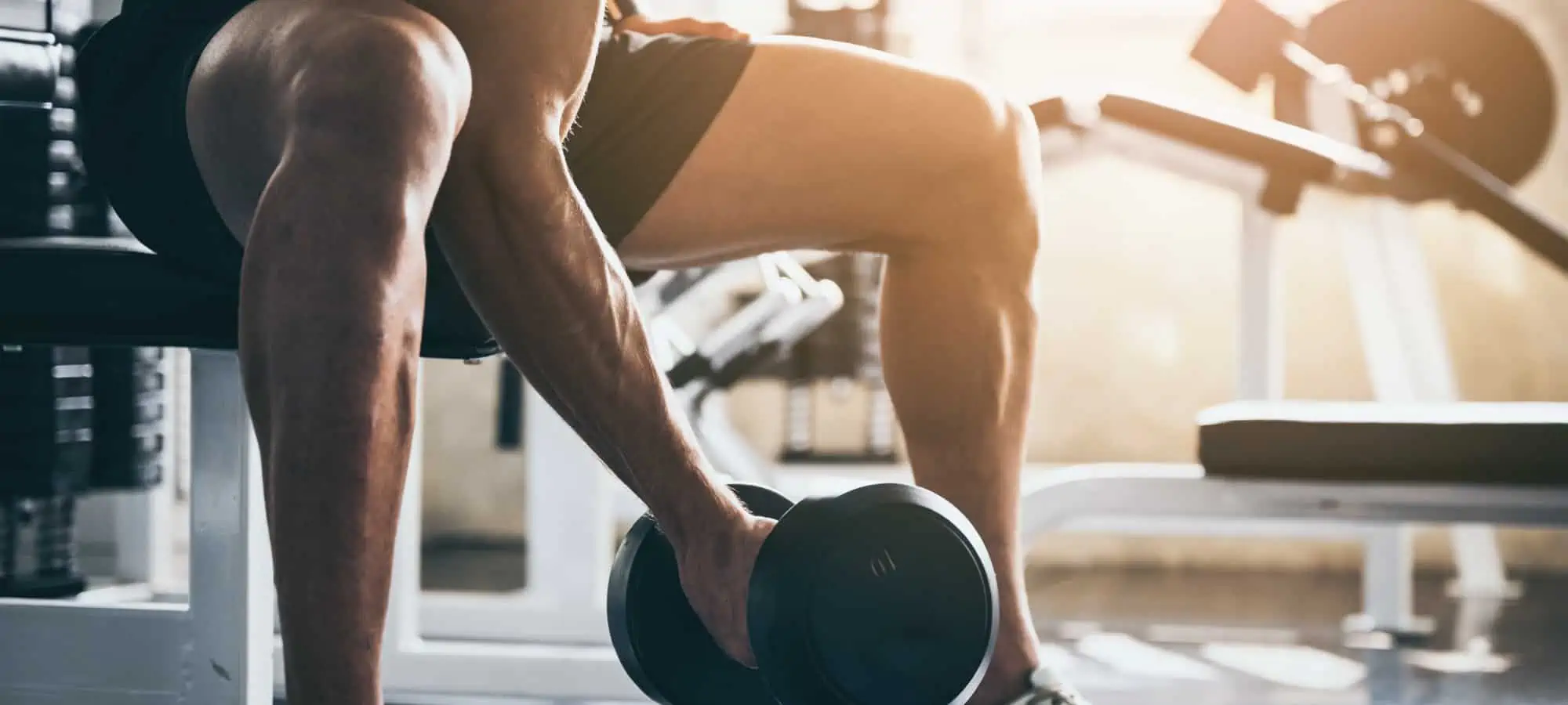 Man lifting a weight in the gym