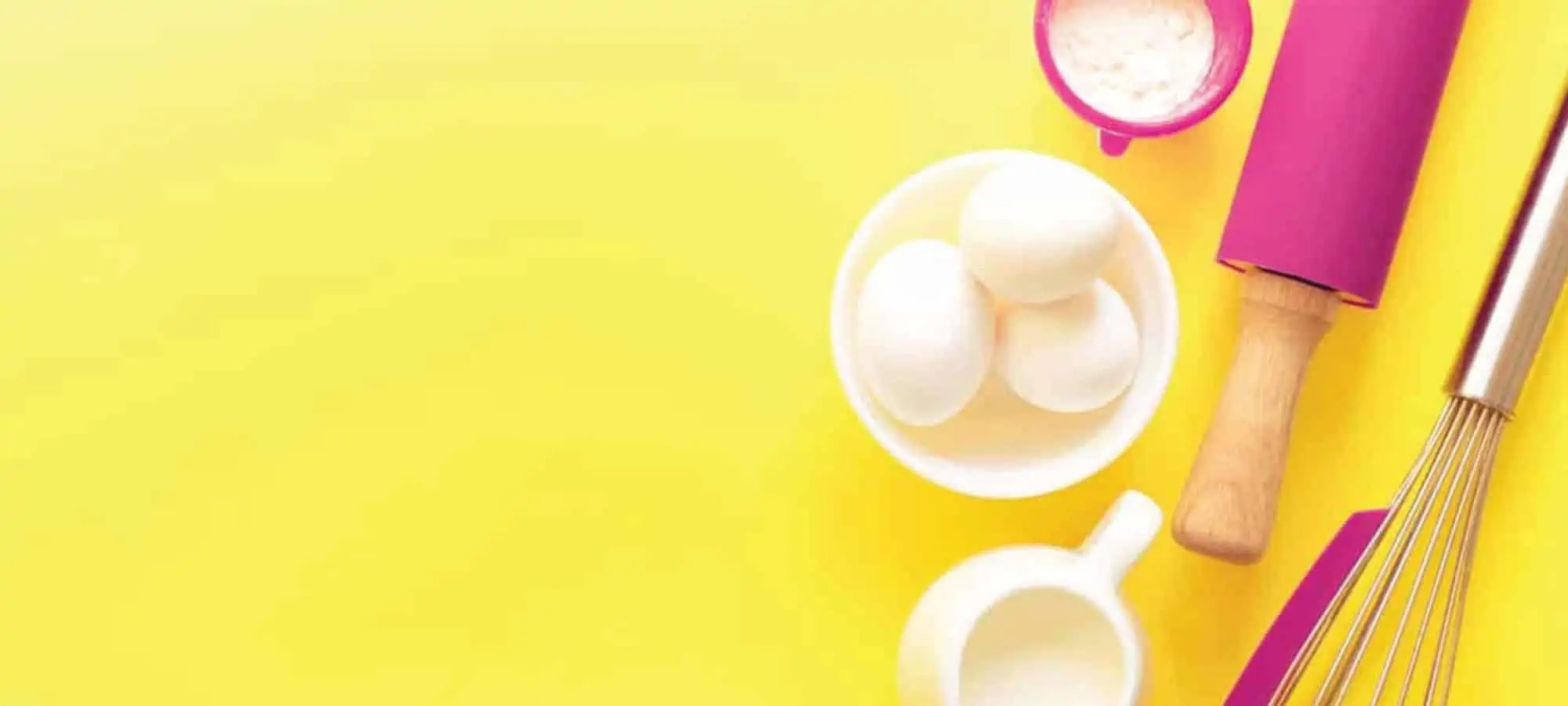 Baking utensils with a yellow background