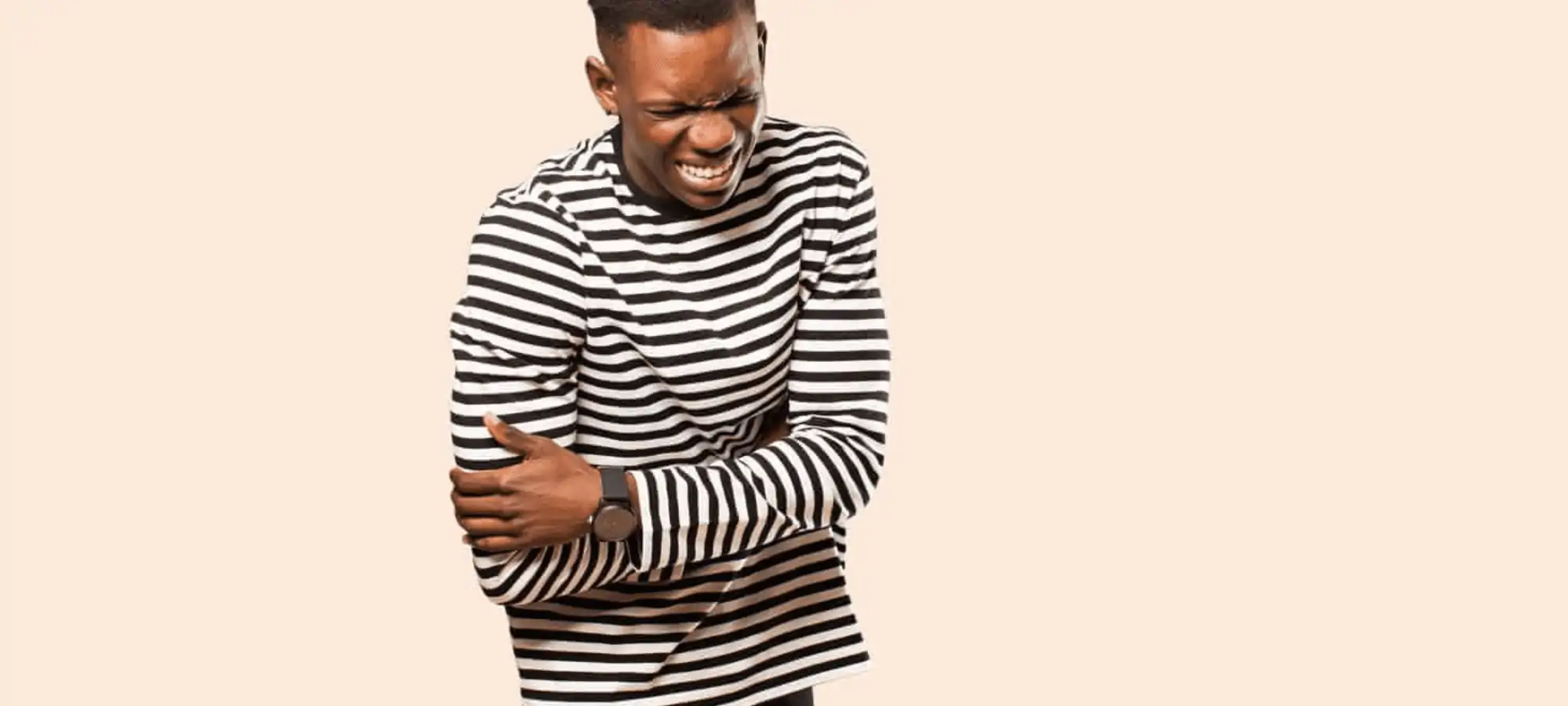 Man clutching stomach