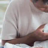 Dad feeding a baby a bottle