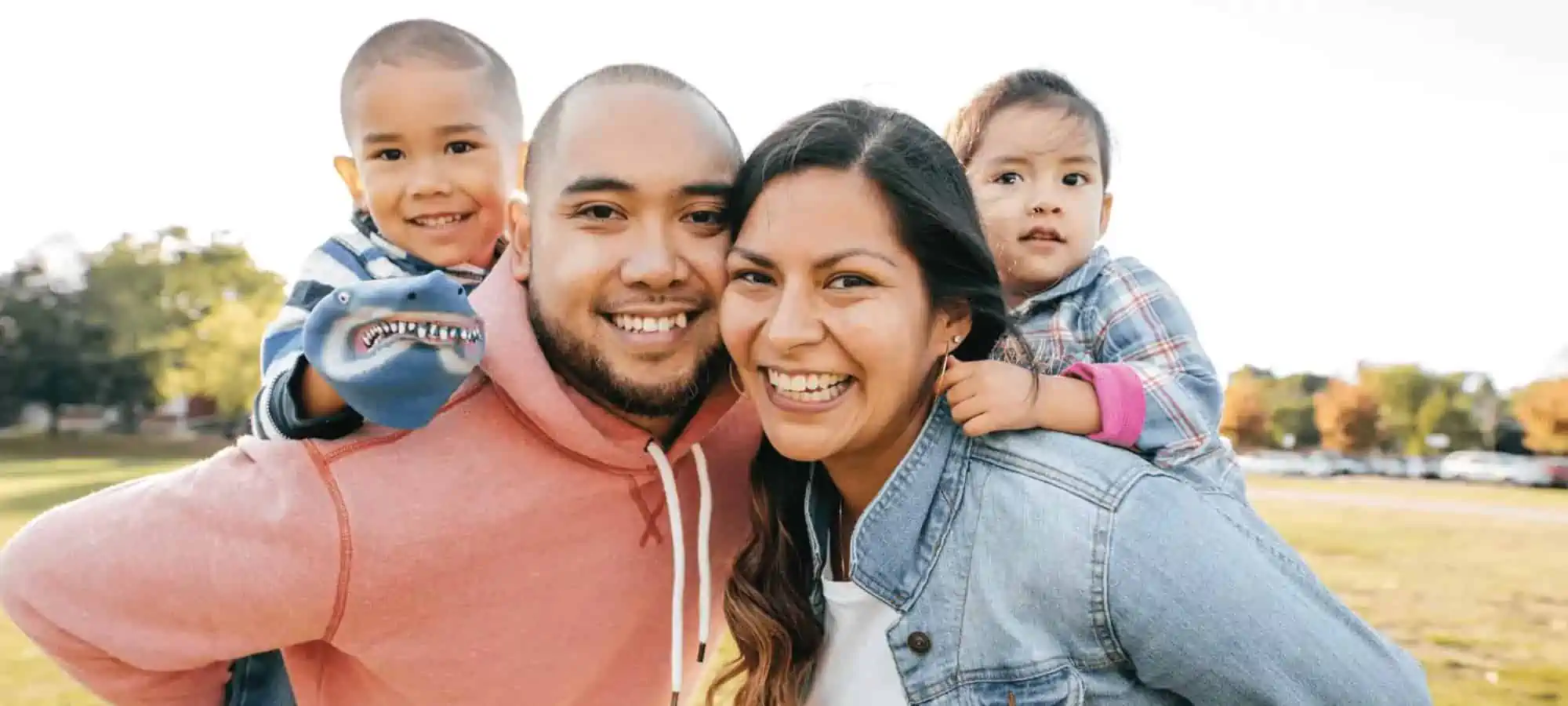 Family smiling into camera