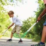 Two young boys playing hockey