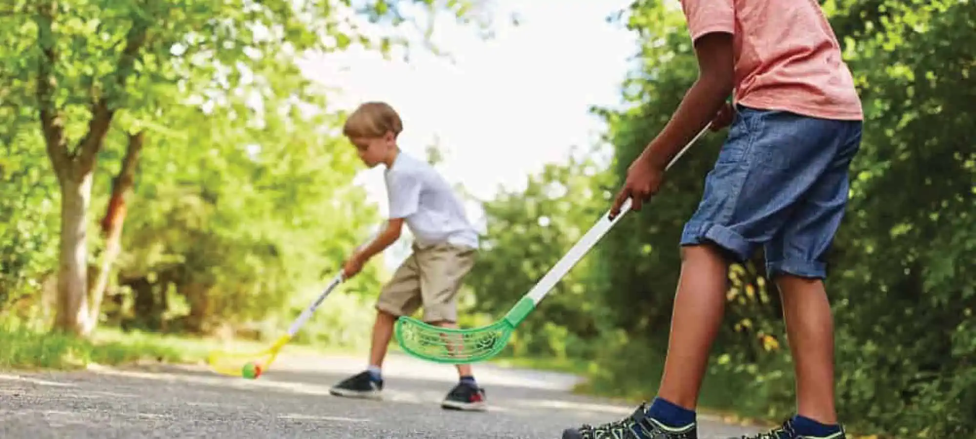 Two young boys playing hockey