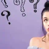 Women pondering with question marks