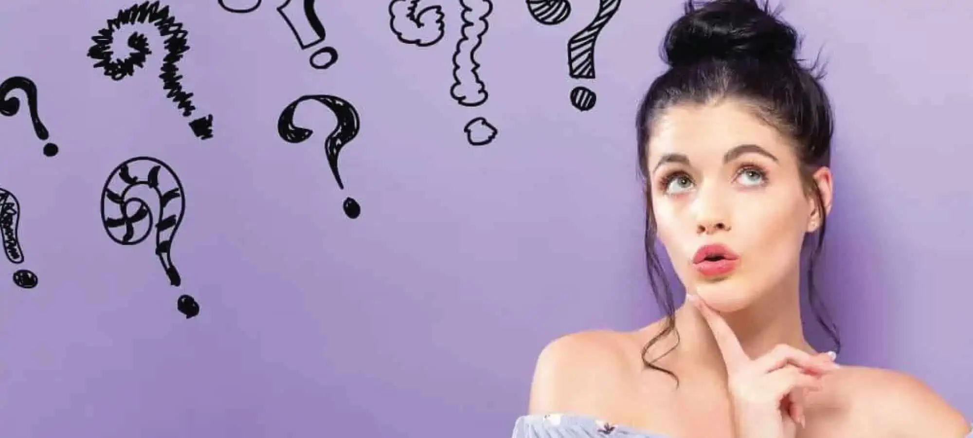 Women pondering with question marks