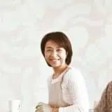 Mom smiling at husband with microbes in the back