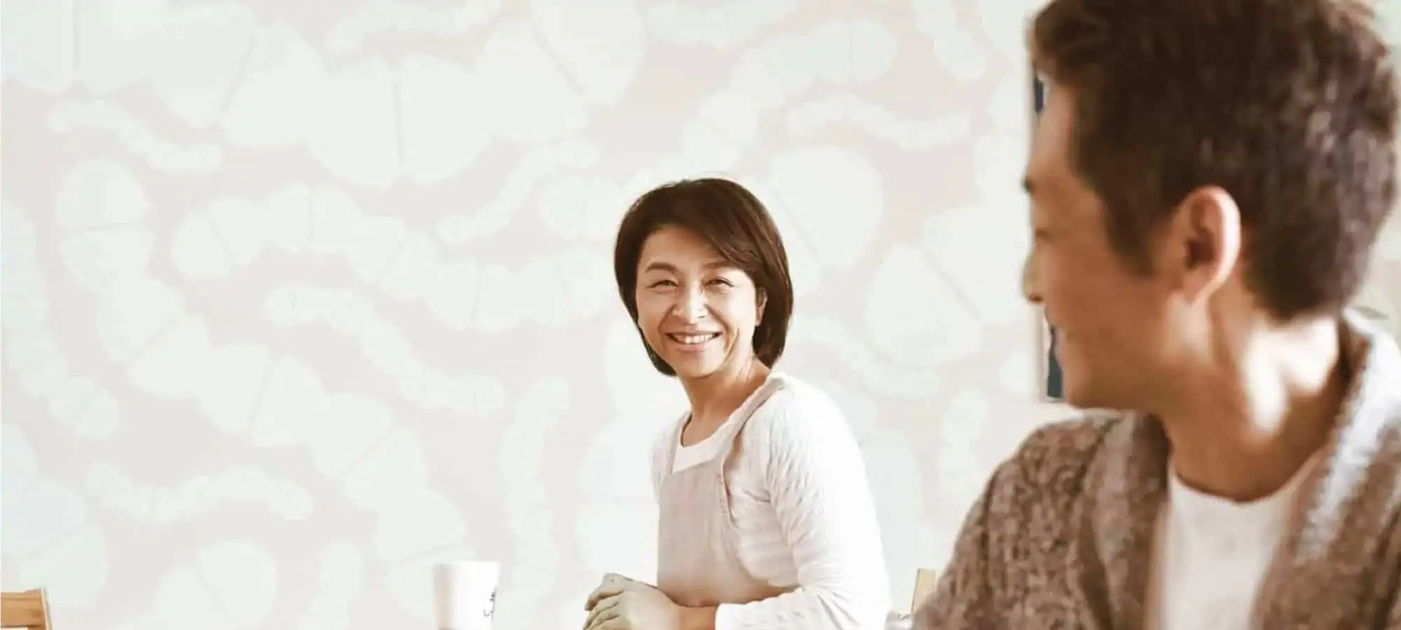 Mom smiling at husband with microbes in the back