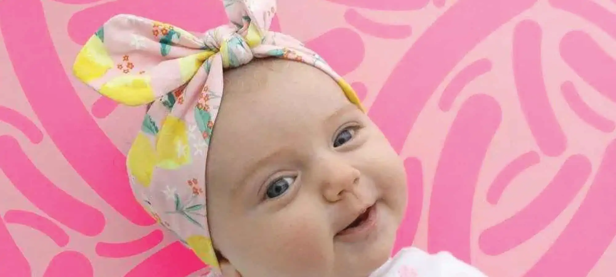 Baby with pink microbes in the back