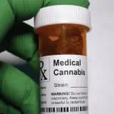 Pill bottle with cannabis in it