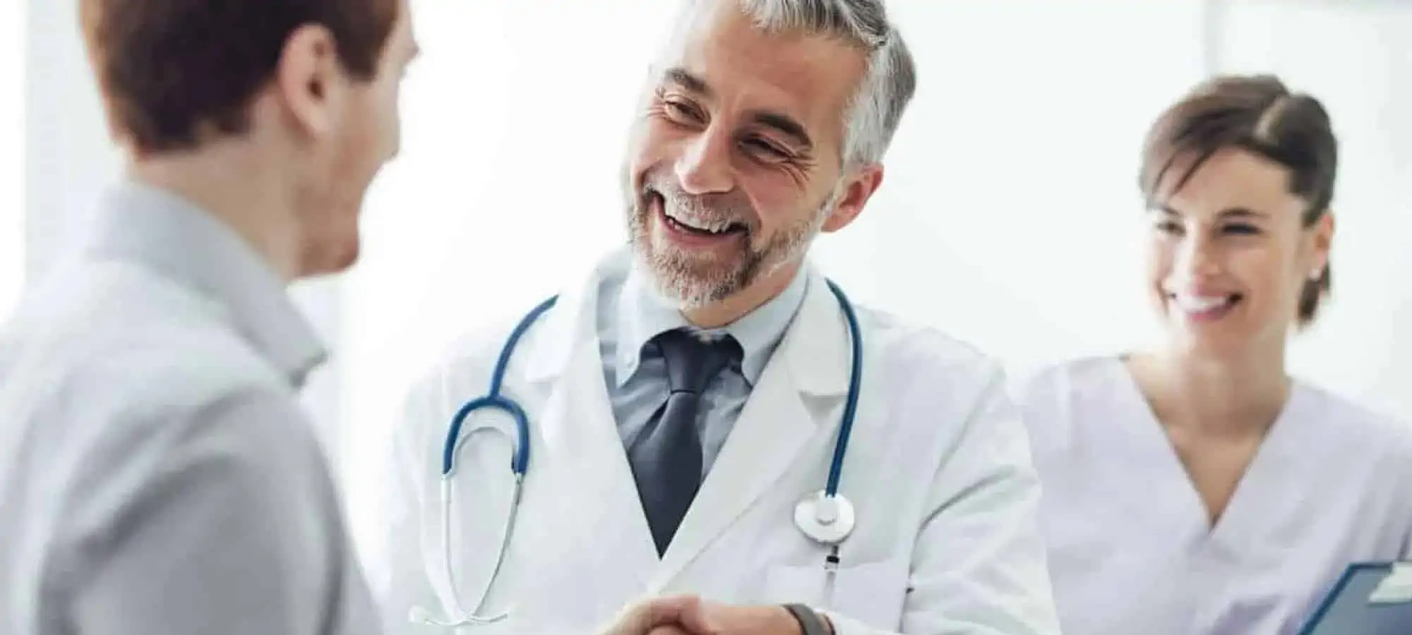 Doctors smiling and shaking hands