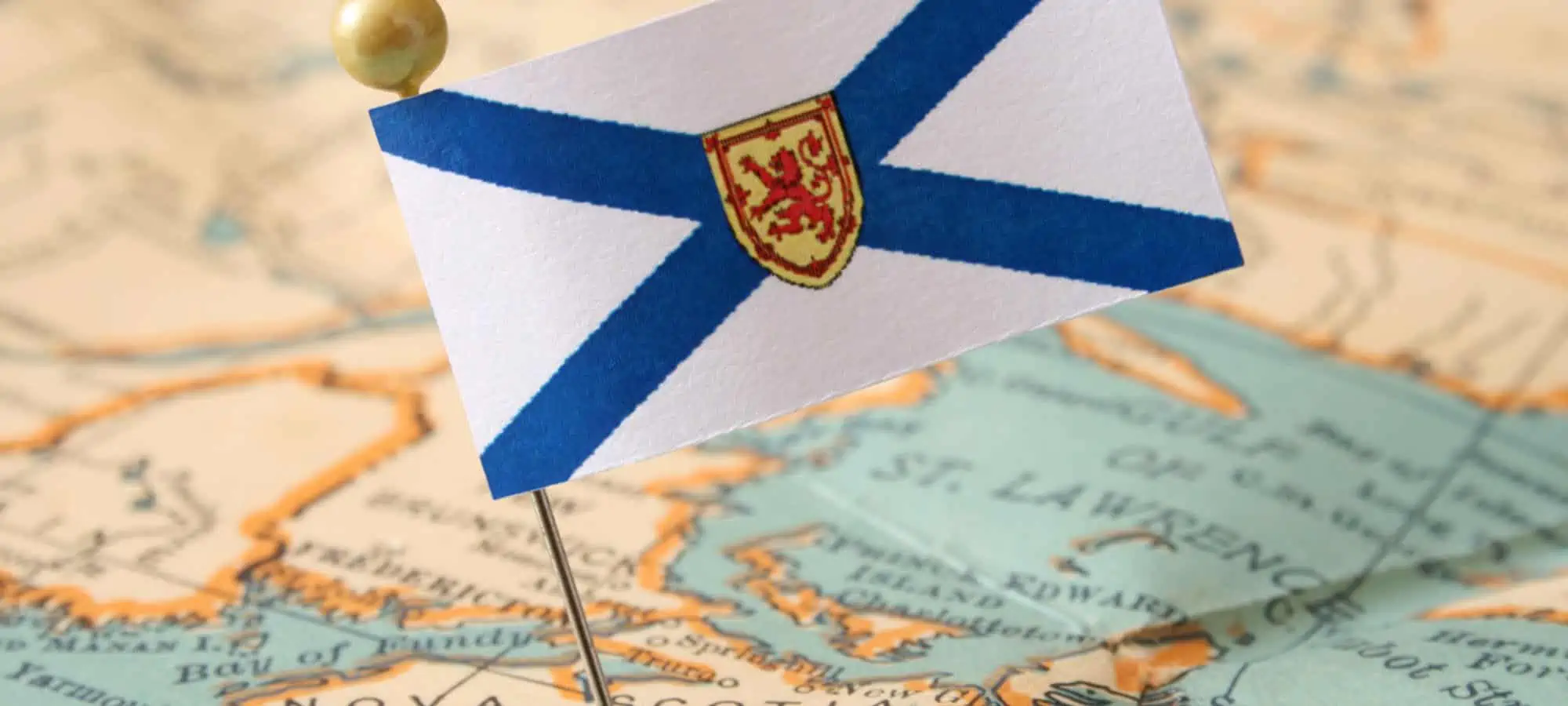 Flag of New Brunswick on a pin stuck on a map showing New Brunswick
