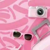 Pink suitcase with microbe background