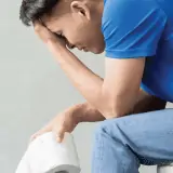 man with ibs on toilet