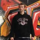 David in the gym looking off to the side