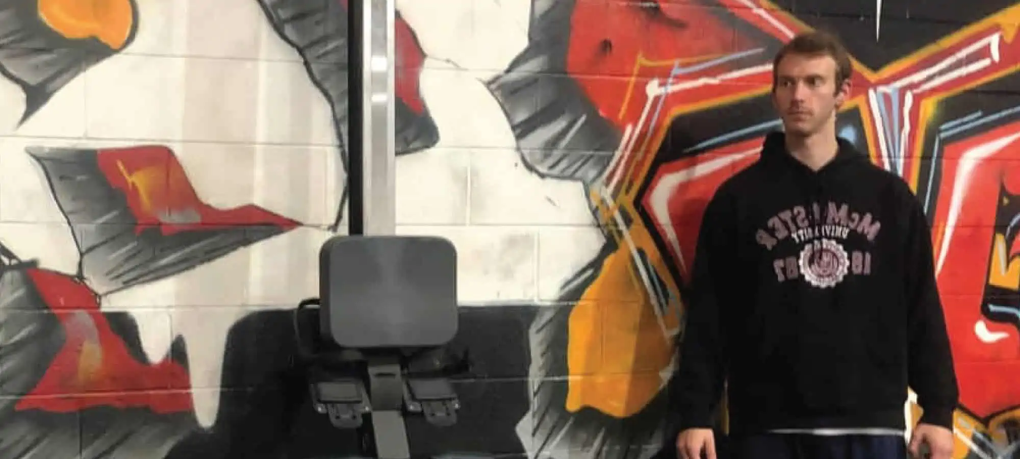 David in the gym looking off to the side