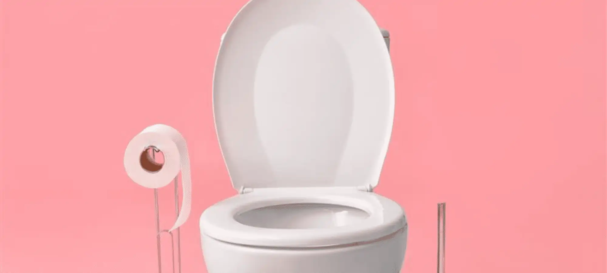 white toilet on pink background