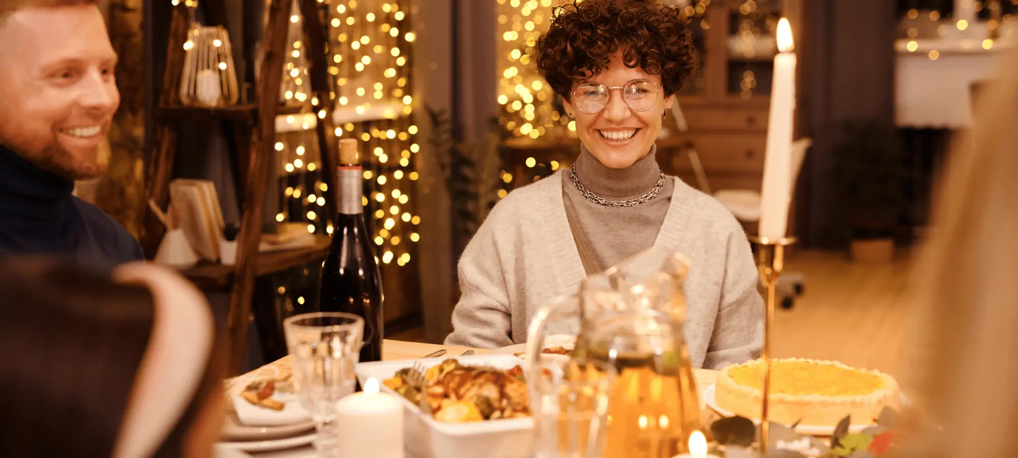 woman gathered with friends at dinner table