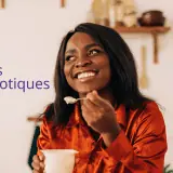 woman eating yogurt with probiotics