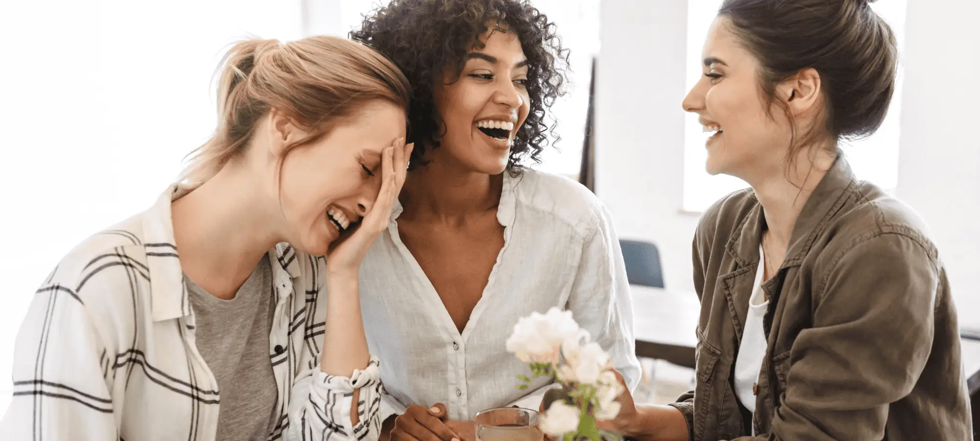 three women laughing