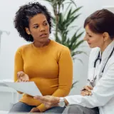 IBD patient speaking to gastroenterologist