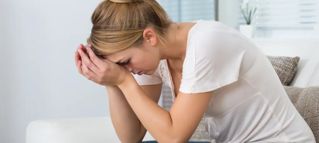 woman experiencing bowel urgency and stress