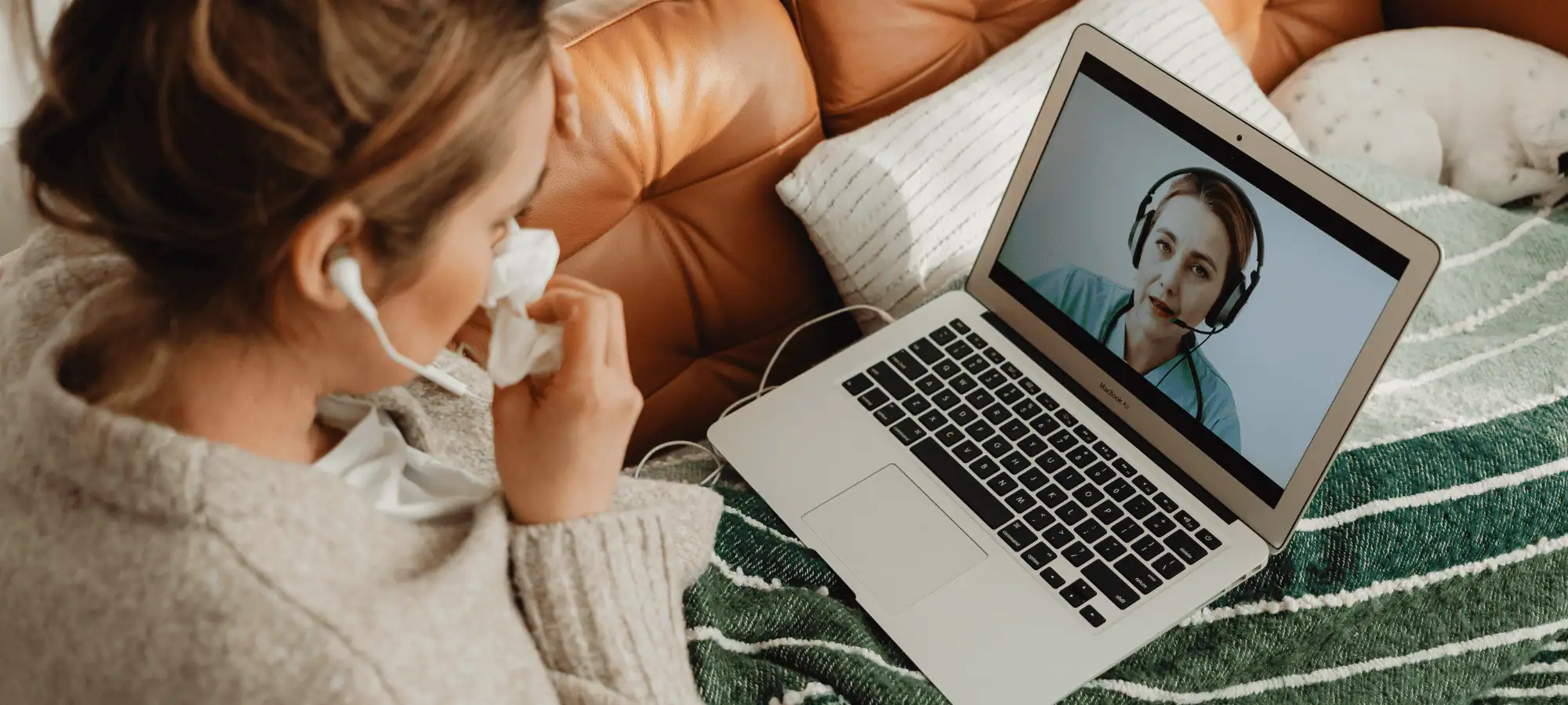 Woman at home not feeling well, having a virtual care visit with her practitioner