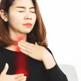 Image of a lady suffering from acid reflux