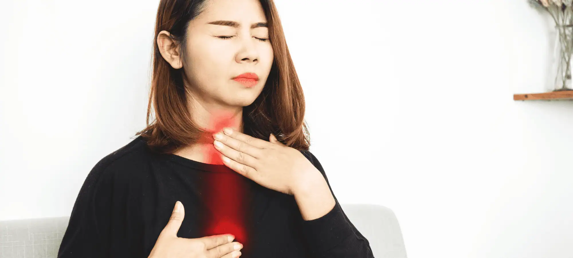 Image of a lady suffering from acid reflux
